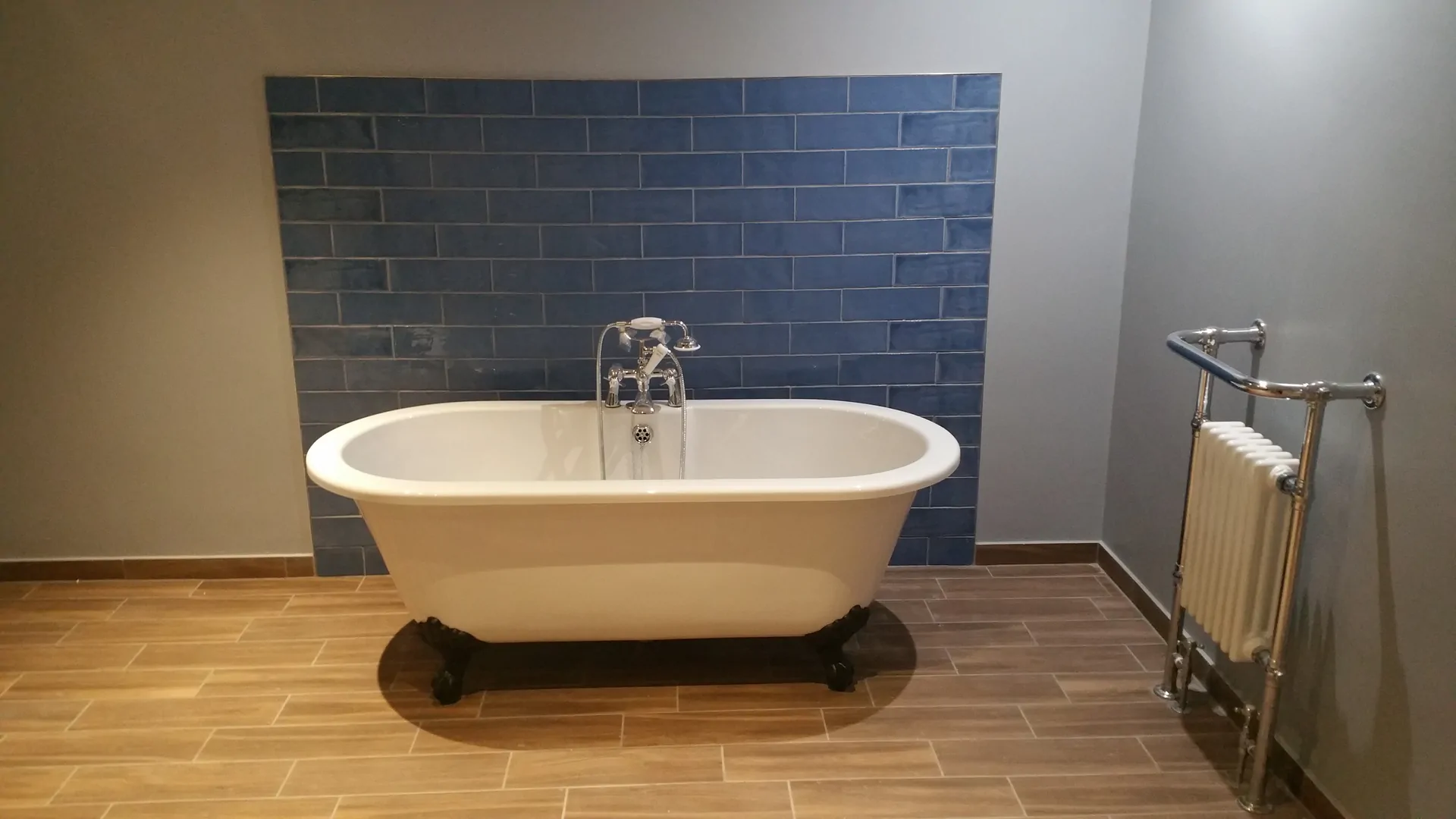 Completed bathroom renovation with freestanding bath