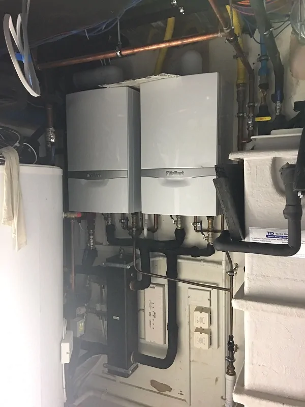 Boiler and heating system installation in a plant room